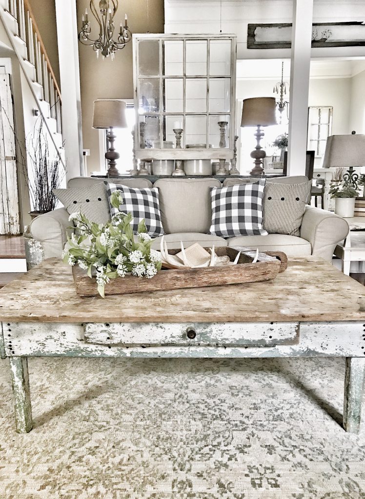 antique coffee table with greenery