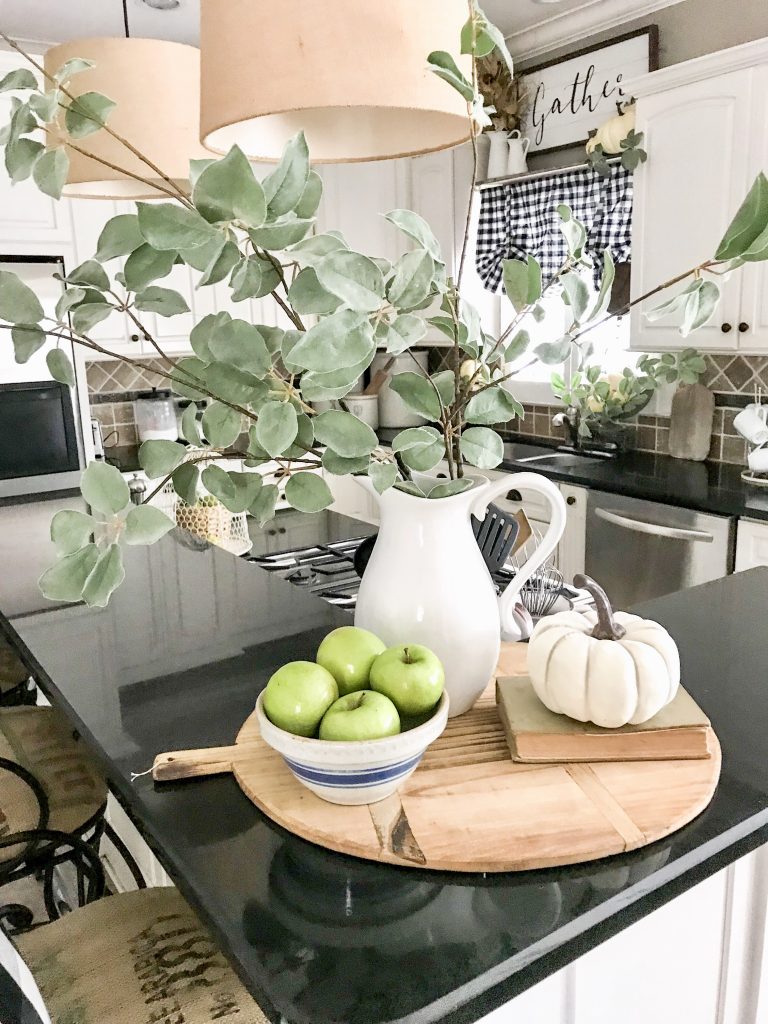 fall blog hop vignette with white pitcher, white pumpkin, and green apples