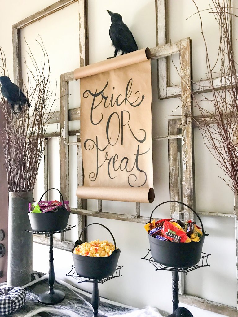 scroll sign hanging behind Halloween candy