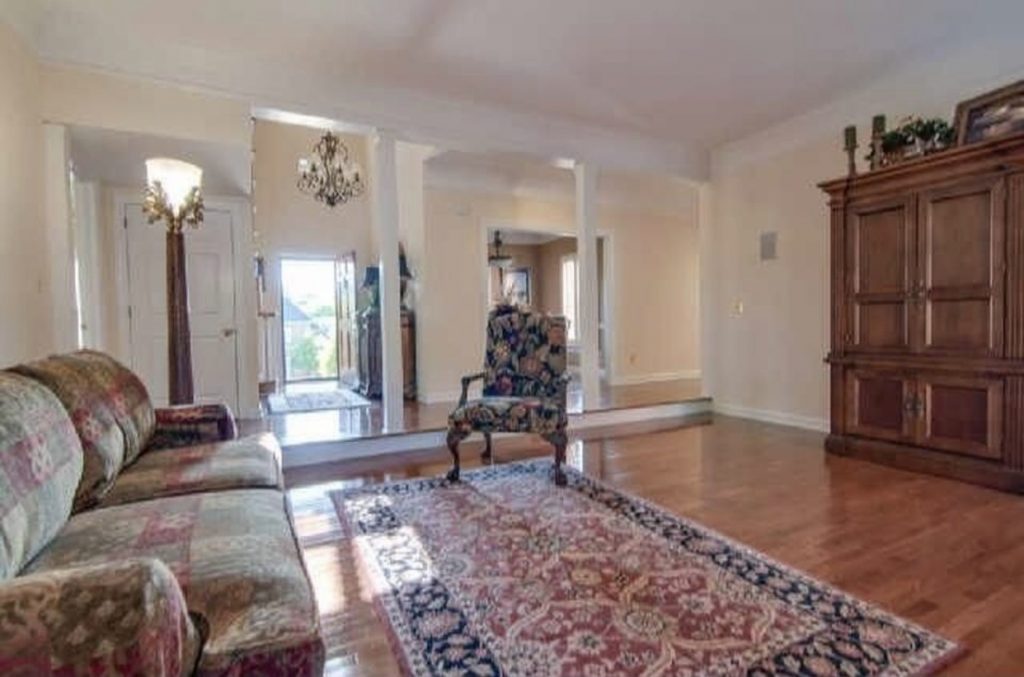 dated living room looking into entryway