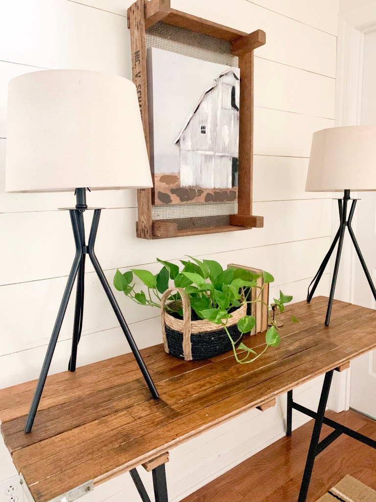 black tripod lamps on modern farmhouse entryway table